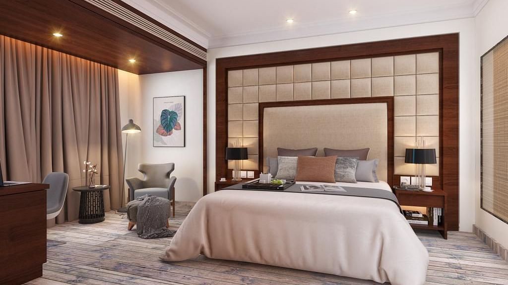 Suite with a king size bed and lamps on each side of the bed at BluSalzz Residence, Amritsar.
